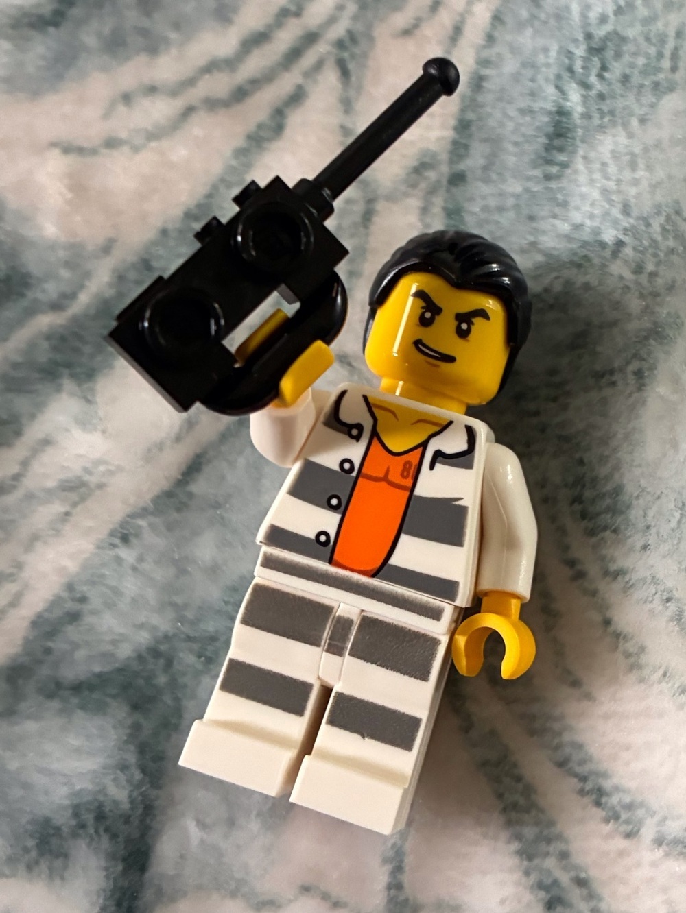 Lego Yellow Minifigure with Black Hair and White/Gray Striped Prison Outfit